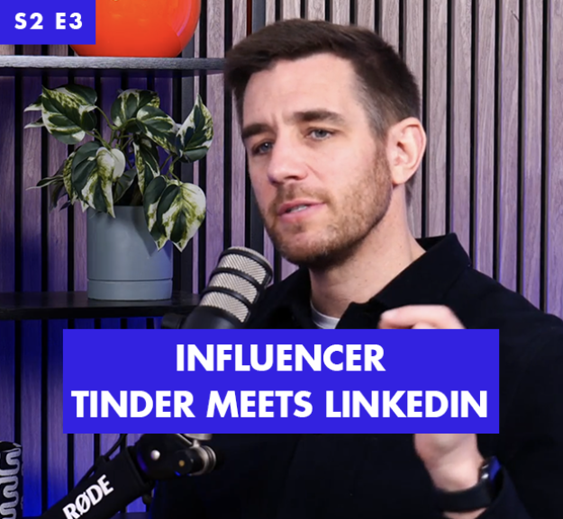 A man in a black shirt gestures expressively while speaking into a microphone, set against a modern backdrop featuring a wooden panel and potted green plants. Bold text below him reads "INFLUENCER TINDER MEETS LINKEDIN," creating a striking visual contrast.