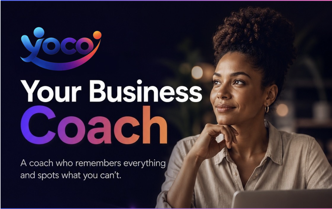A poised woman with curly hair gazes thoughtfully while seated in a softly lit workspace, adorned with warm hues. Her beige shirt contrasts against the vibrantly designed background featuring the logo 'yoco' and bold text announcing 'Your Business Coach', emphasising a professional yet inviting atmosphere.