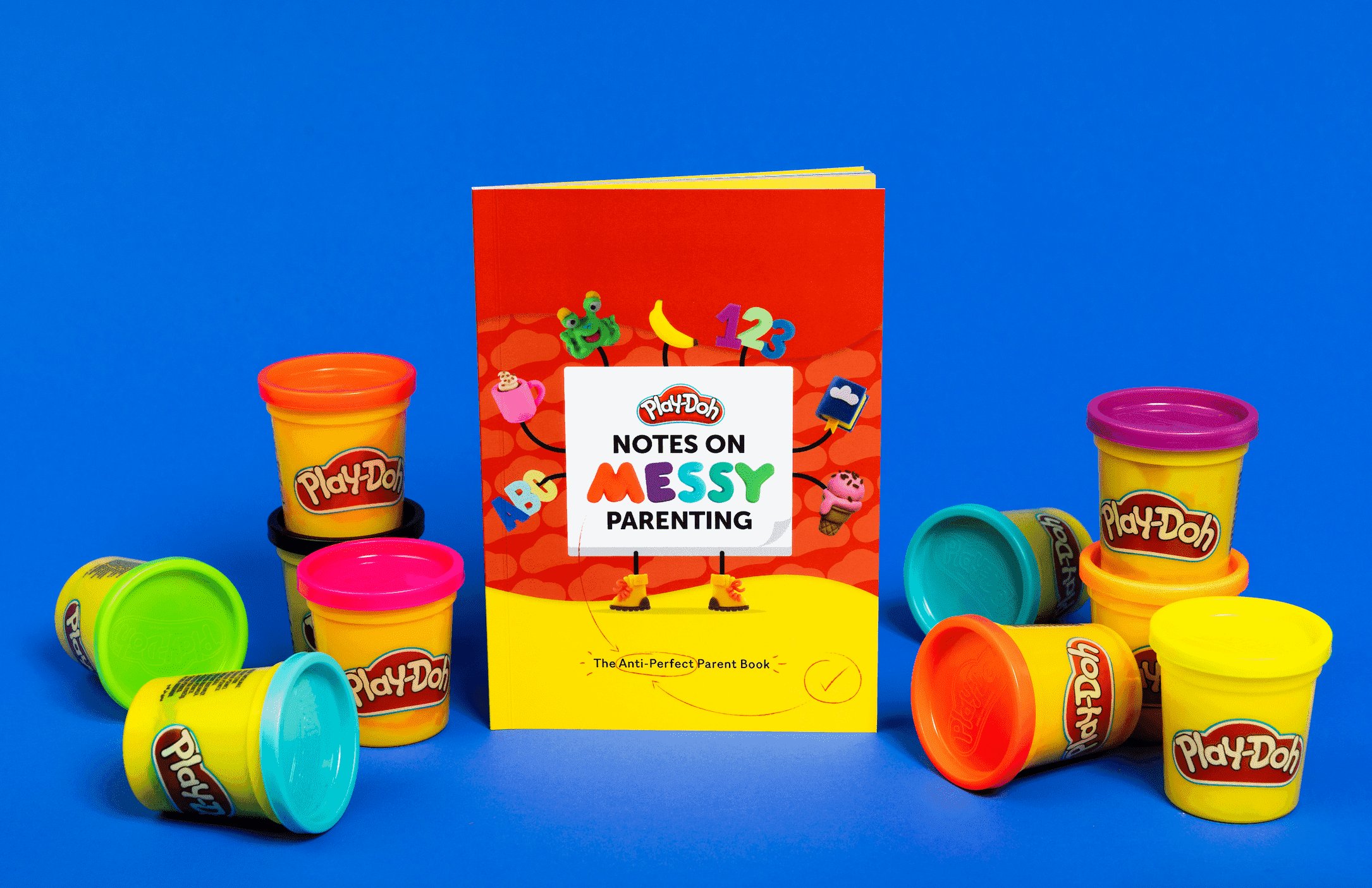 Notes on messy parenting book with play-doh pots