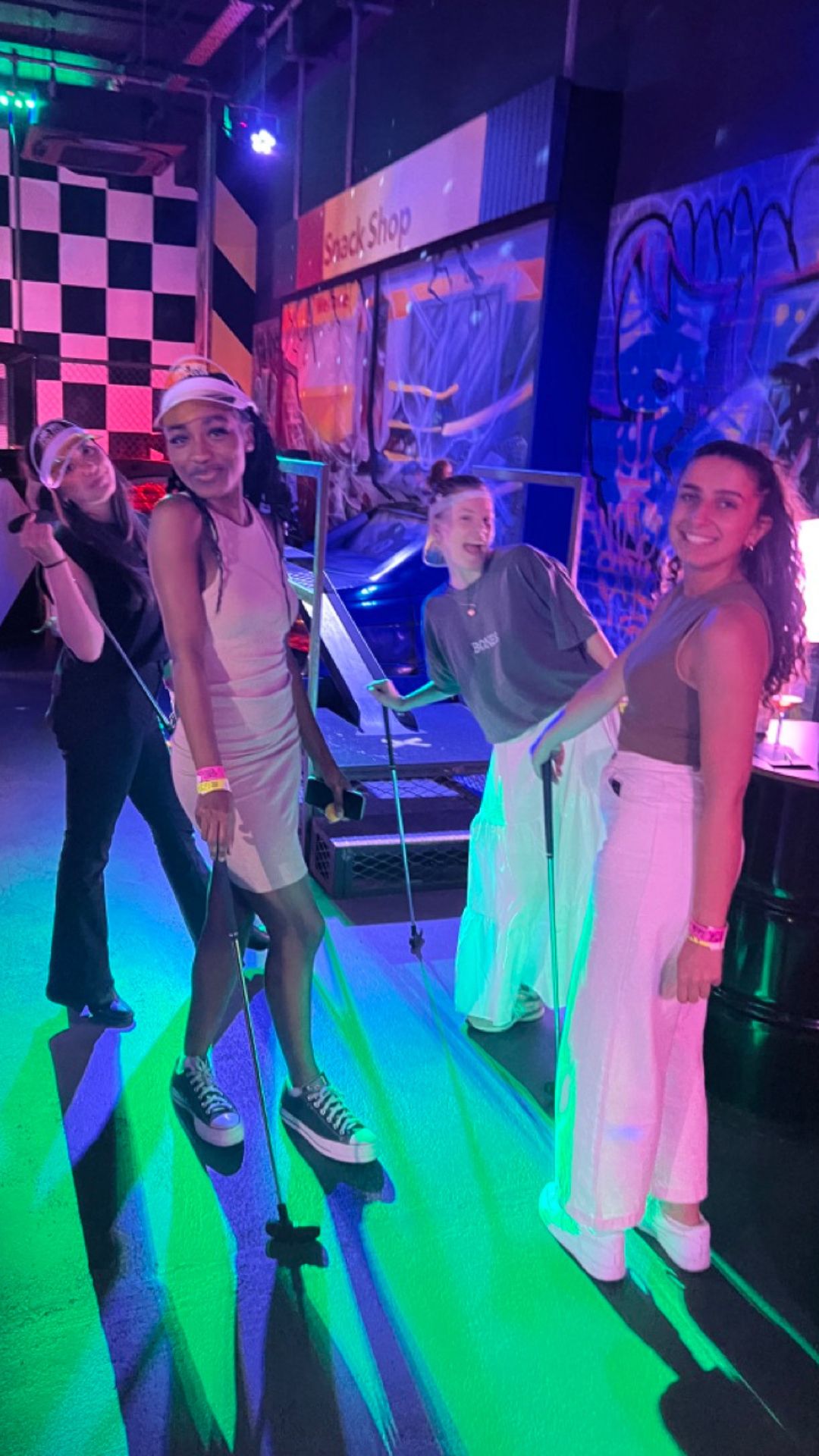 A neon lit group photo