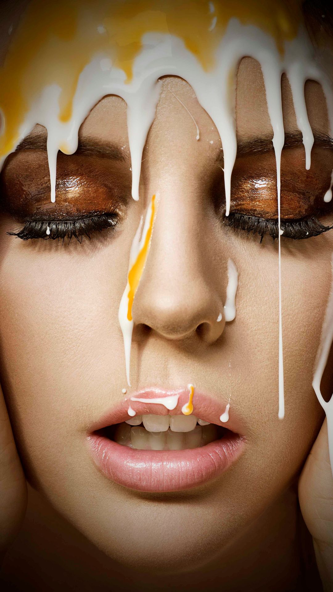 A creme egg dripping down a women's face