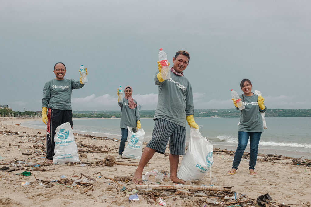 Cleaning up plastic on a beach