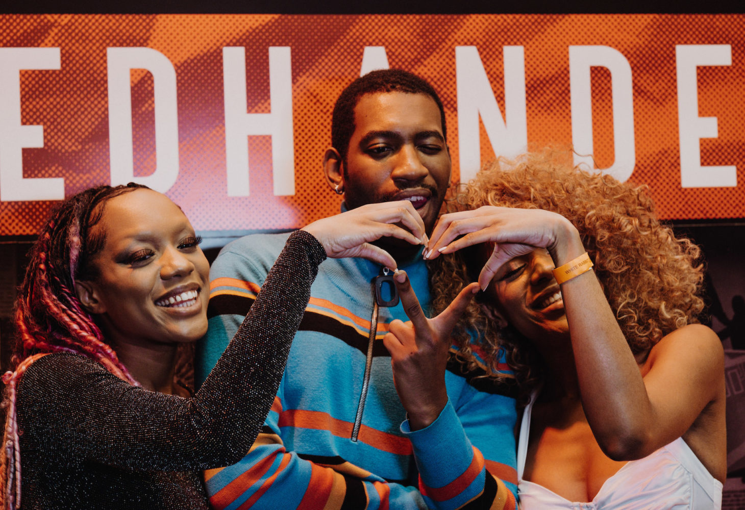 People making a hand gesture