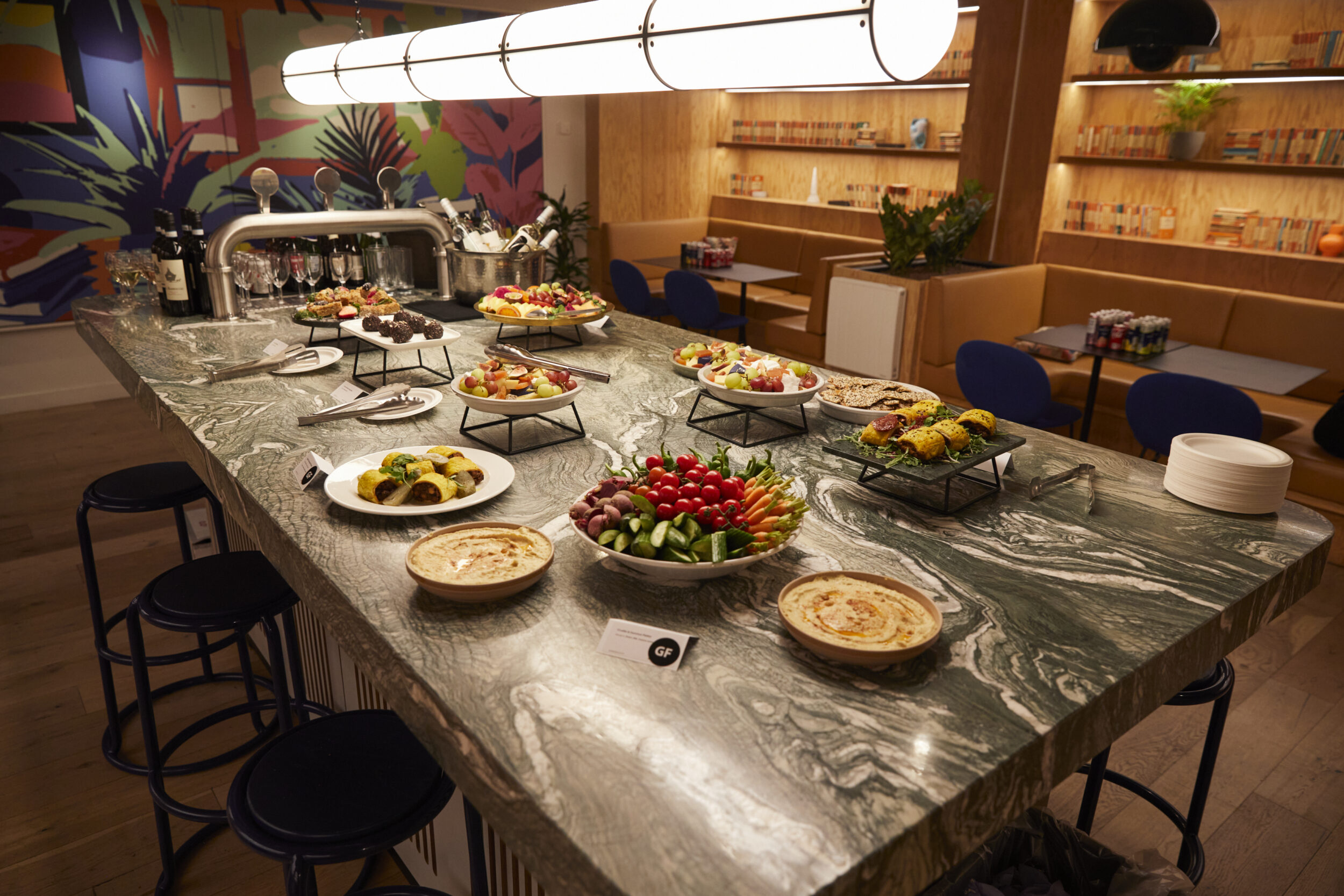 A wide range of food displayed on plates on a granite worktop
